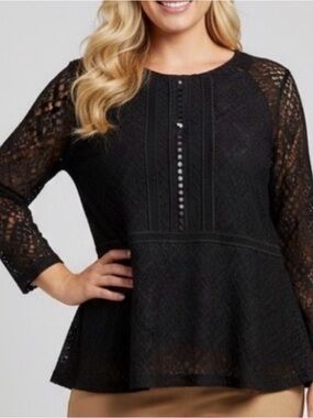 Elegant Black lined Lace Top with peplum and sheer panel inserts.